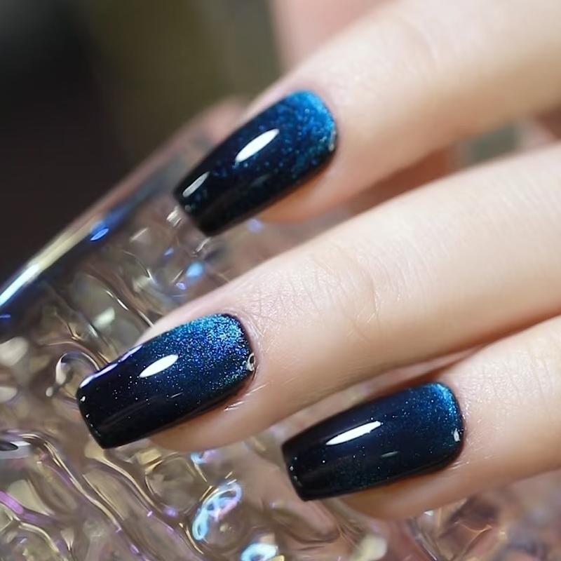 cosmic-midnight-blue-glitter-nail-design